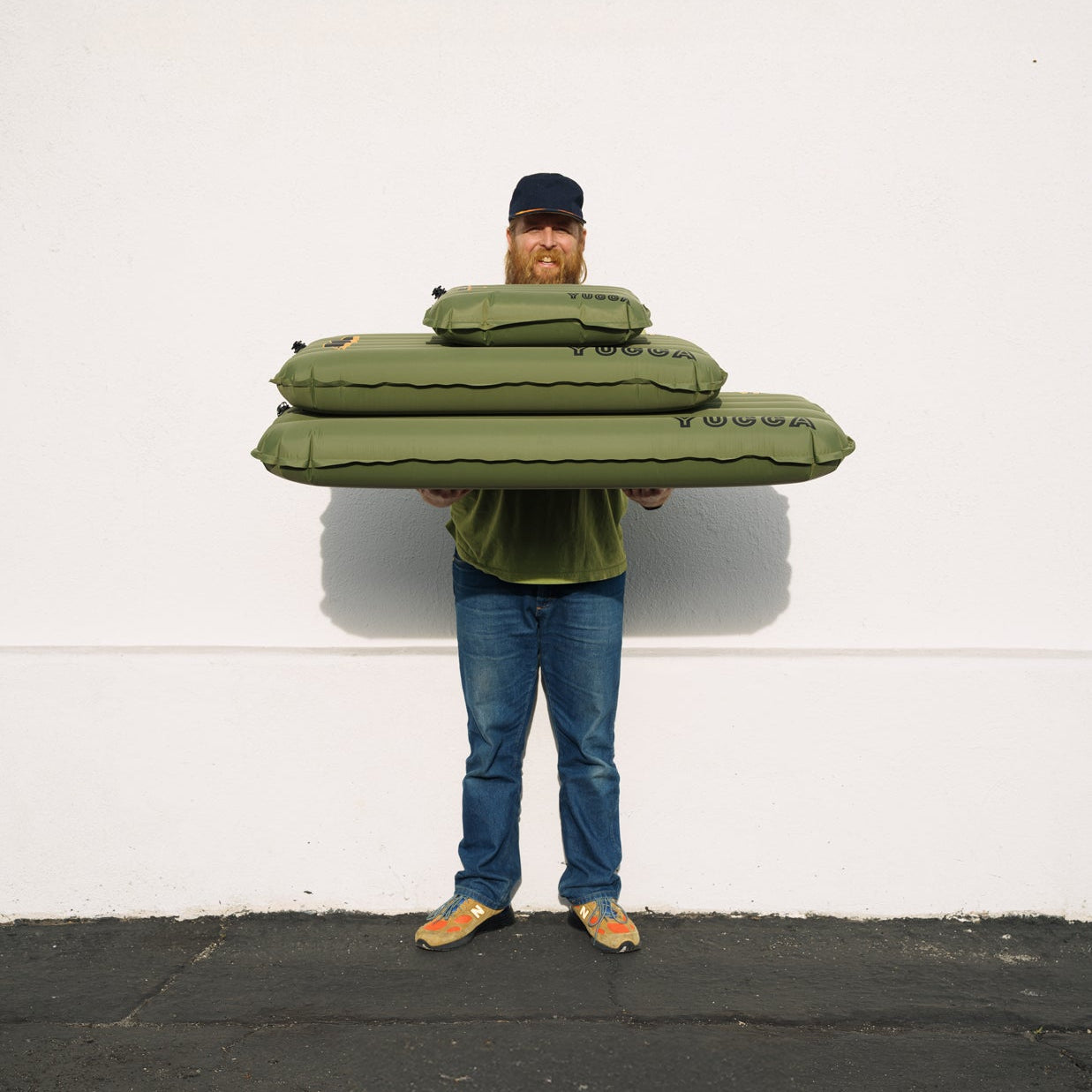 Man holding Yucca Merlyn Surf Matts